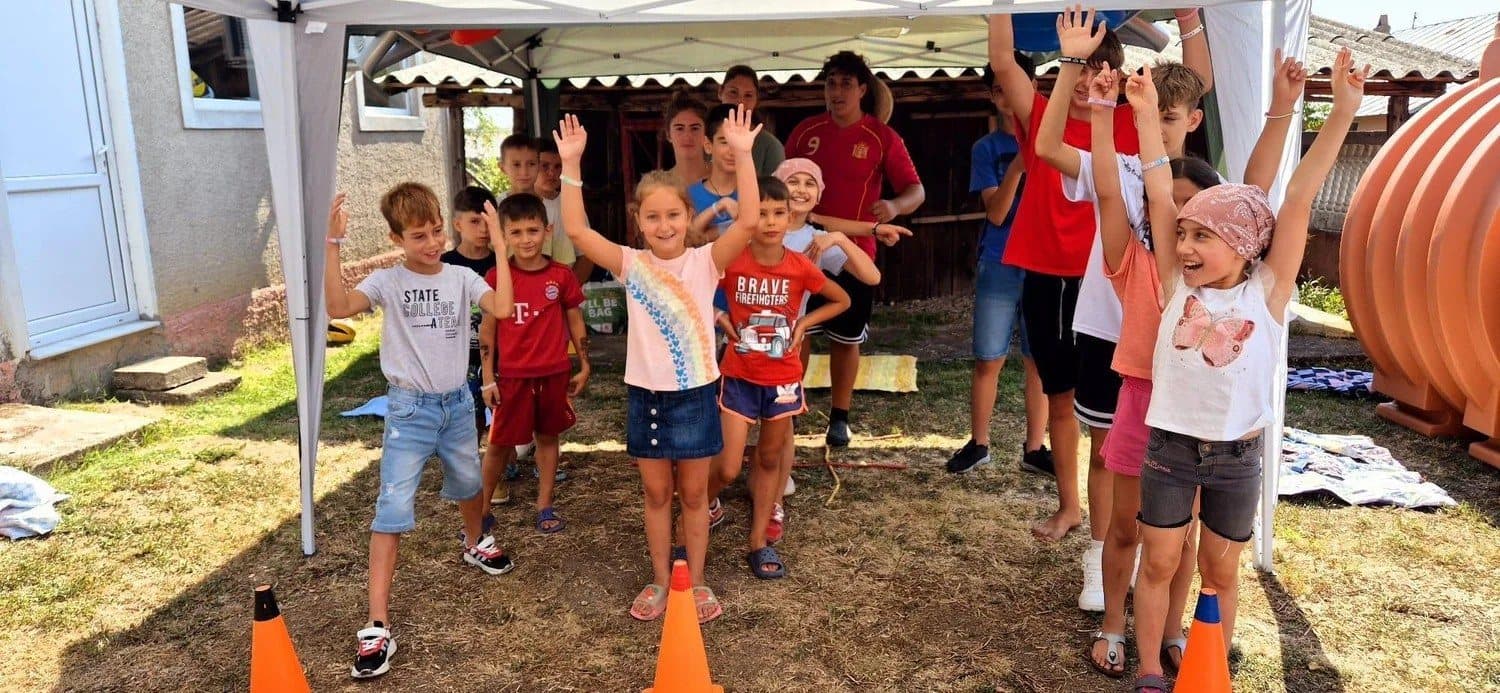 Kids cheering at camp